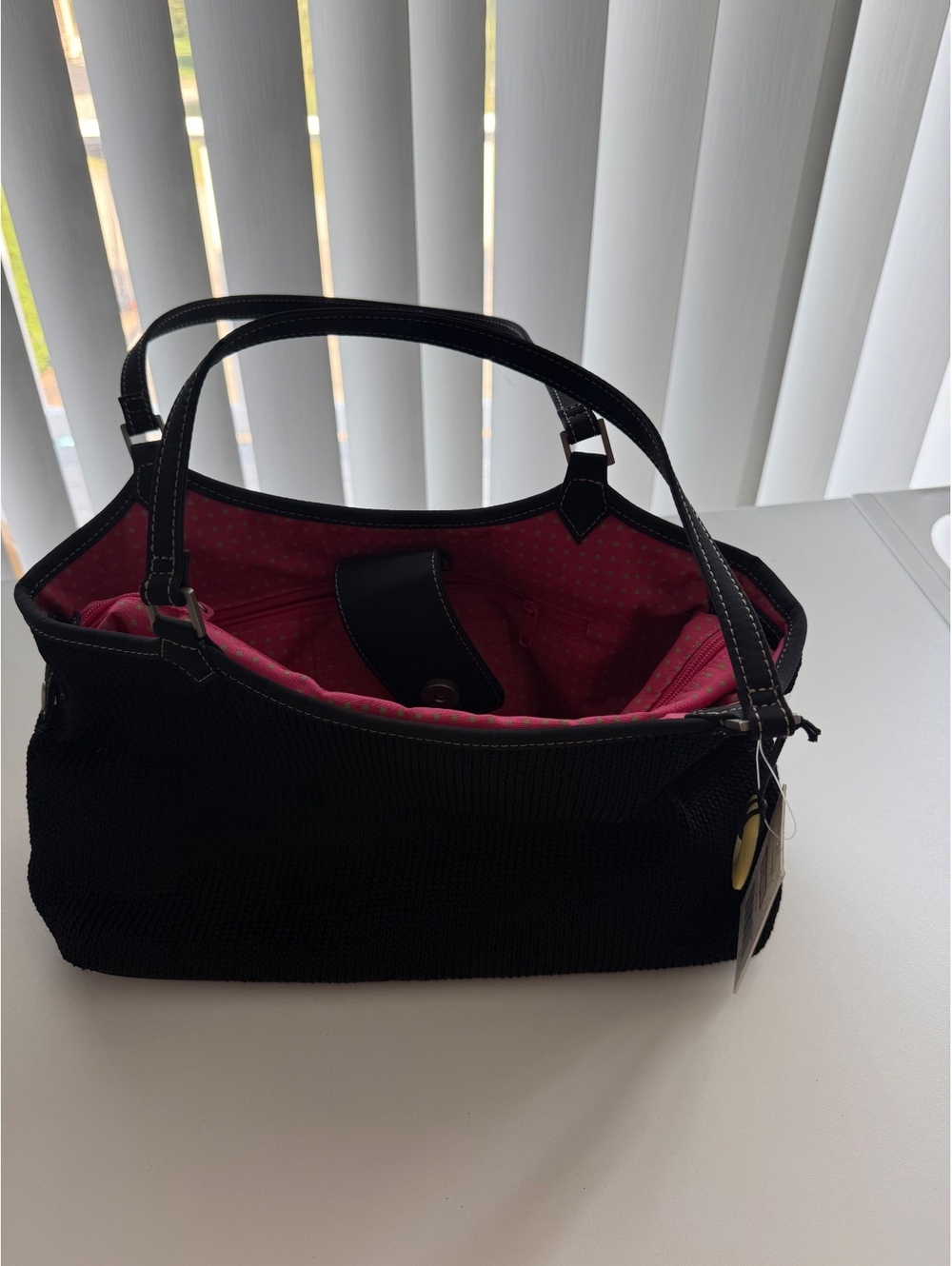 The Sak Black Knit Handbag with Pink Polka Dot Interior and Leather Handles